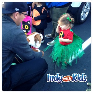 trick or treat halloween indy with kids petting a dog