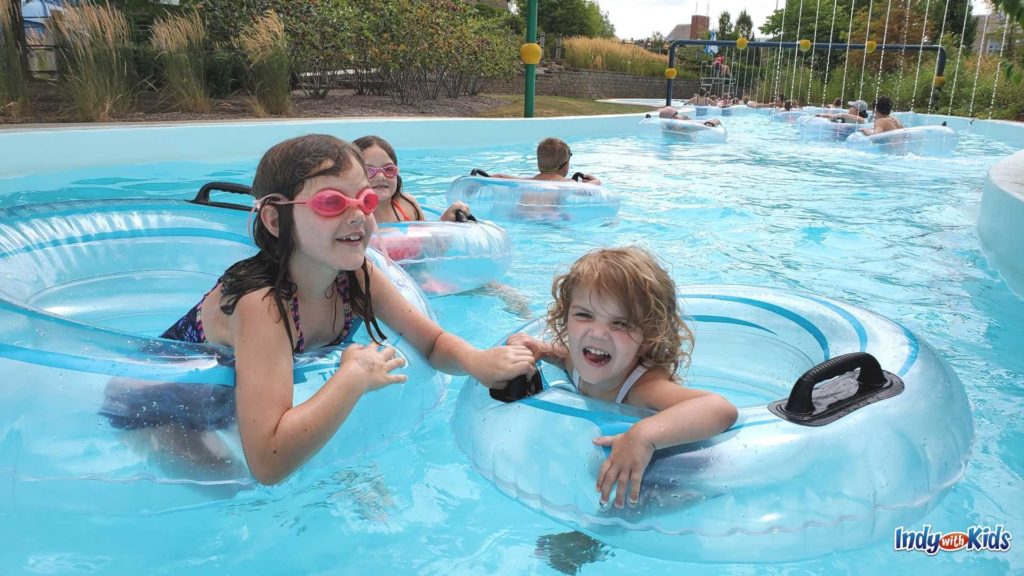Carmel Water Park: Little girls play in clear inner tubes on the Lazy River at the Monon Community Center