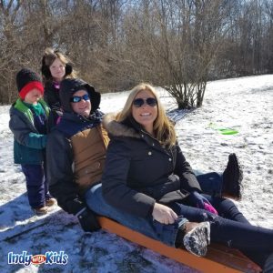 family on a sled at bookside park in Indianapolis