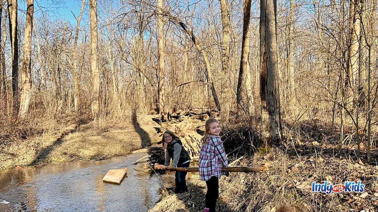 Two girls play near the river at Thornwood Nature Preserve.