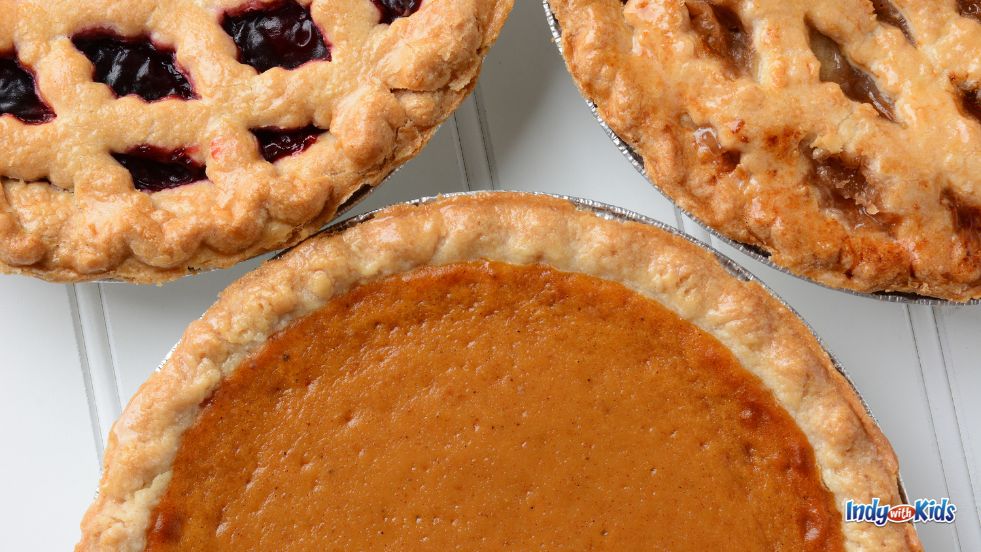 Pi Day Deals Near Me: Two fruit pies and a pumpkin pie sit on a white tabletop.