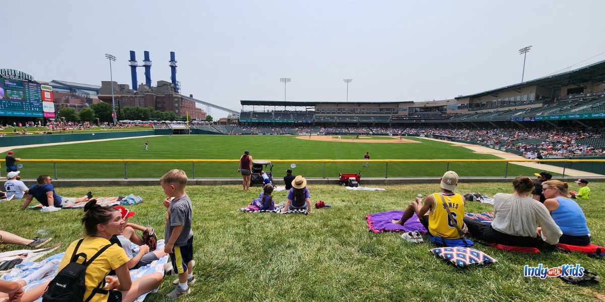 Indianapolis Indians baseball game fans sitting on the lawn,