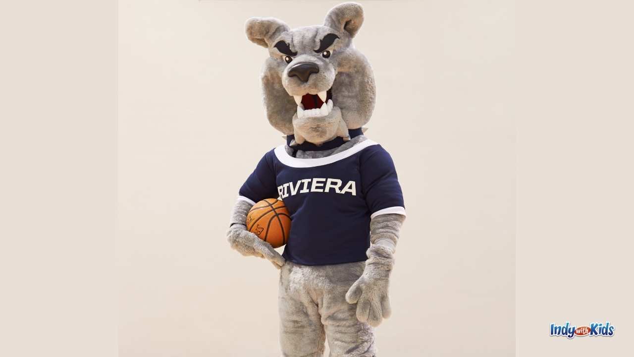 A college basketball mascot holds a basketball in this list of March madness games and activities for kids.