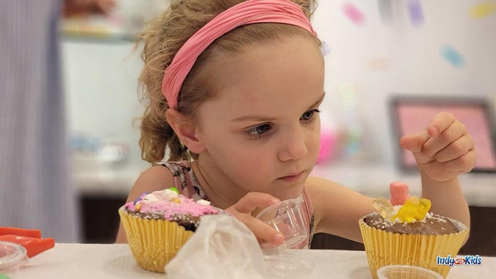Cupcake decorating at Greenwood's Cake Kreations is a perfect family activity.