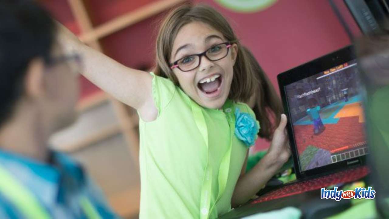 iD Tech Girl playing a video game