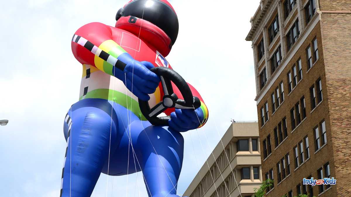 500 Festival Parade: Giant race car driver balloon float