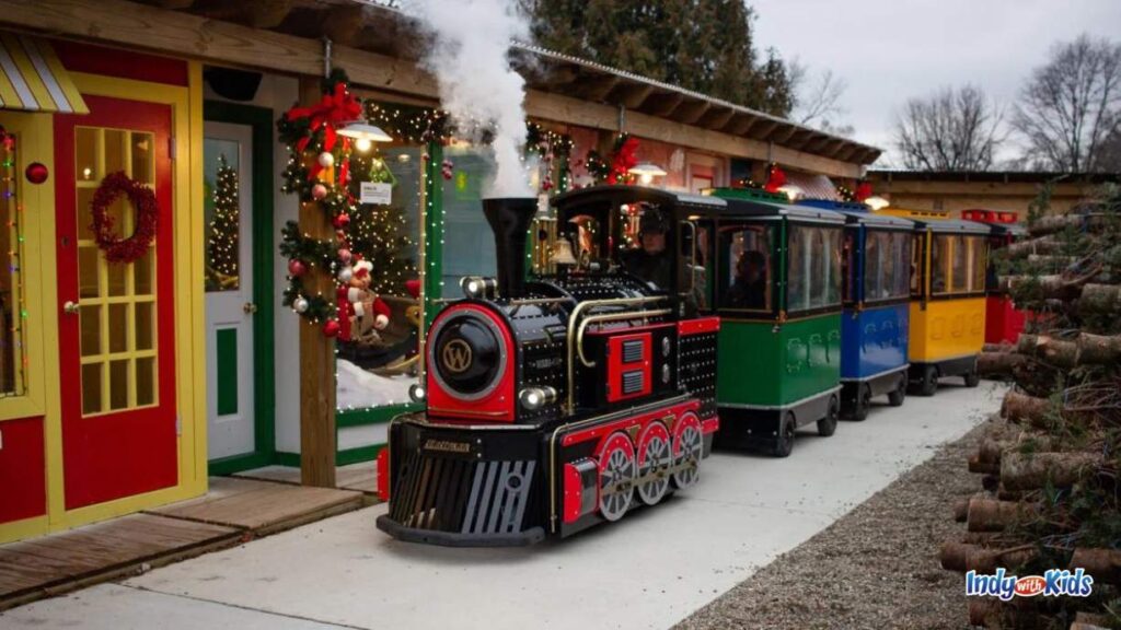 Train Rides in Indiana: a steam engine at Sullivan hardware pulls open air train cars through the Santa express 