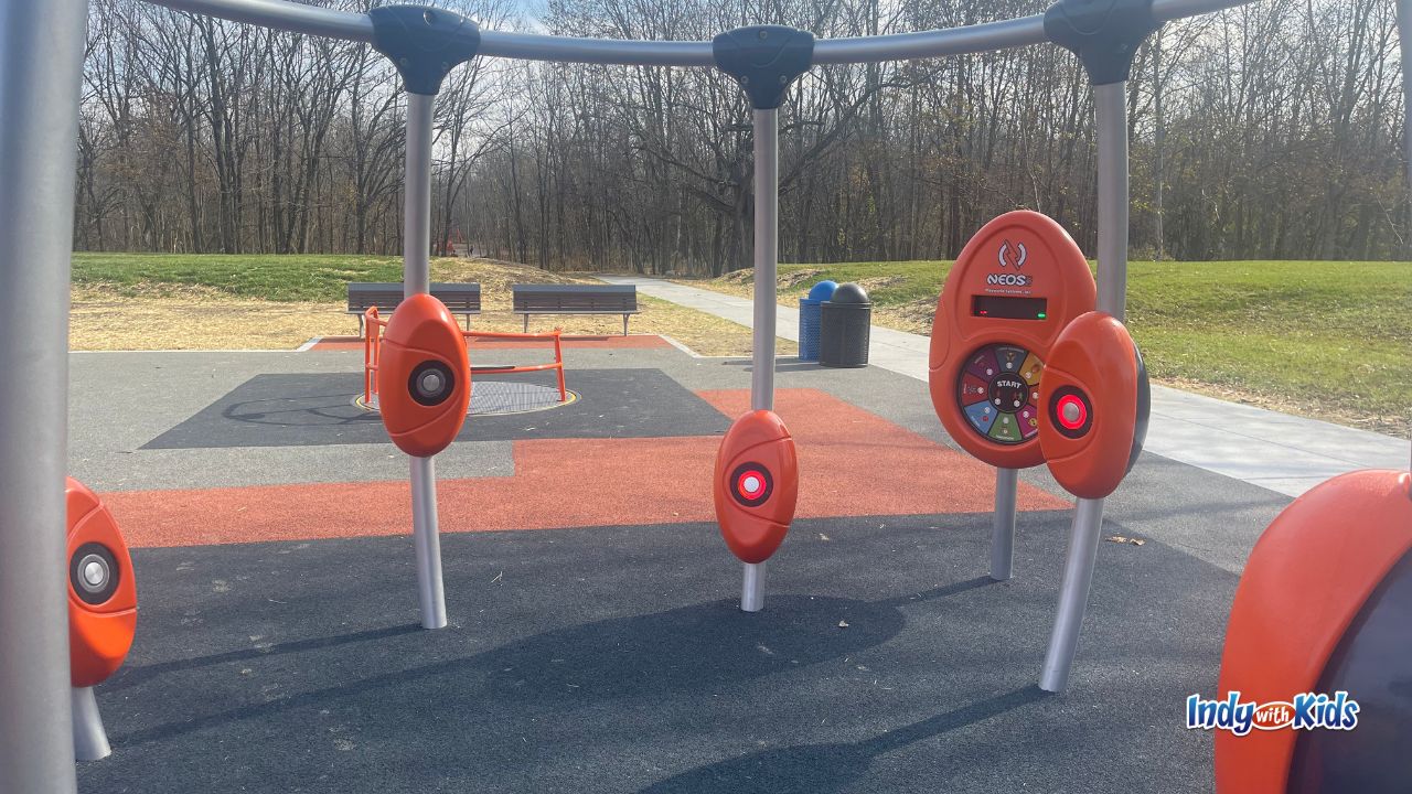 An electronic interactive game structure with colored buttons on posts at River Heritage Park Carmel.