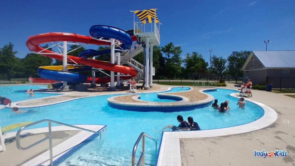 a lazy river at Seashore Waterpark opens to a main pool which is also attached to the waterslides pictured in the background