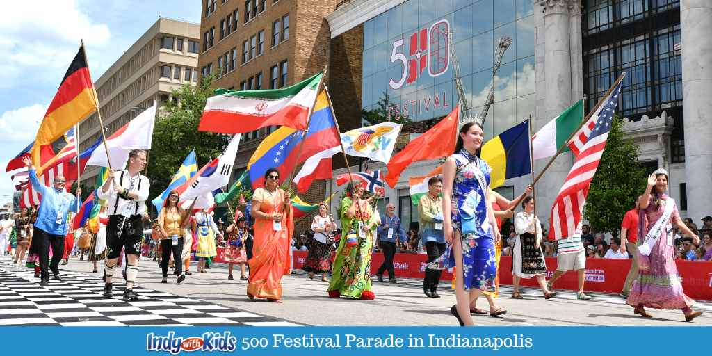 500 Festival Parade in downtown Indianapolis participants with flags