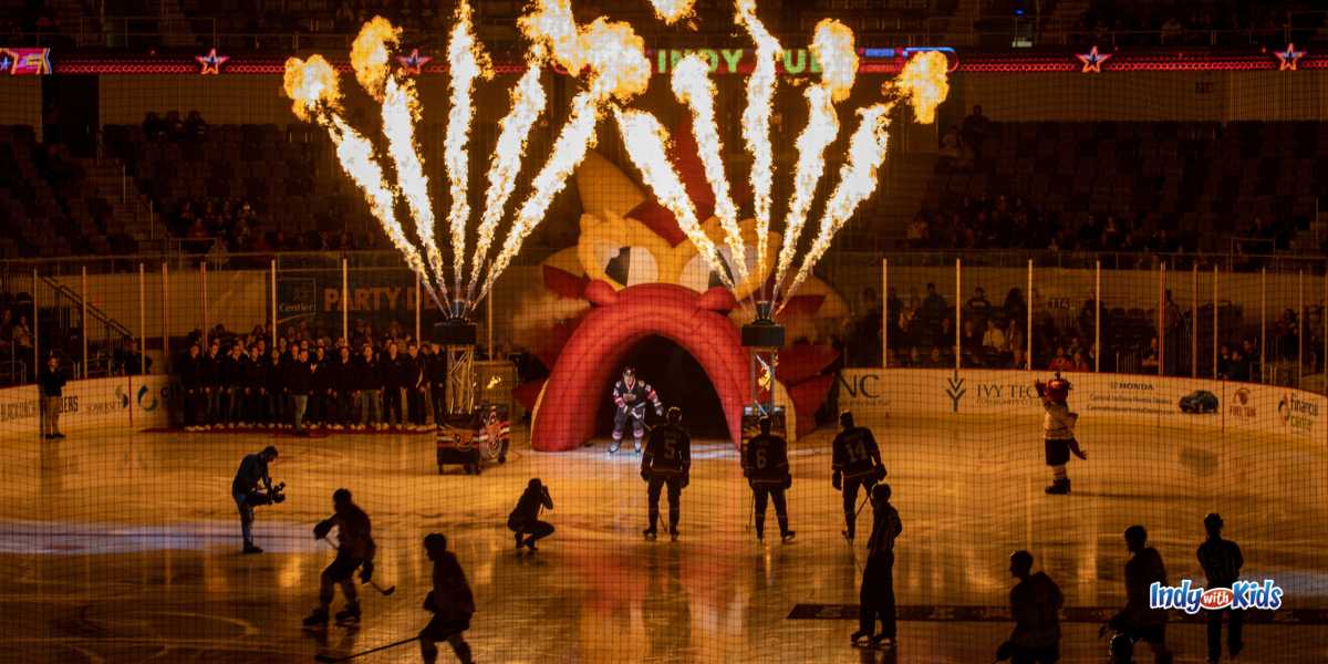 Jets of fire shoot in the air in front of an inflatable red dragon's head that forms a tunnel, allowing hockey players from the Indy Fuel to skate through to an ice rink. Fuel games are a blast for February Date Nights.