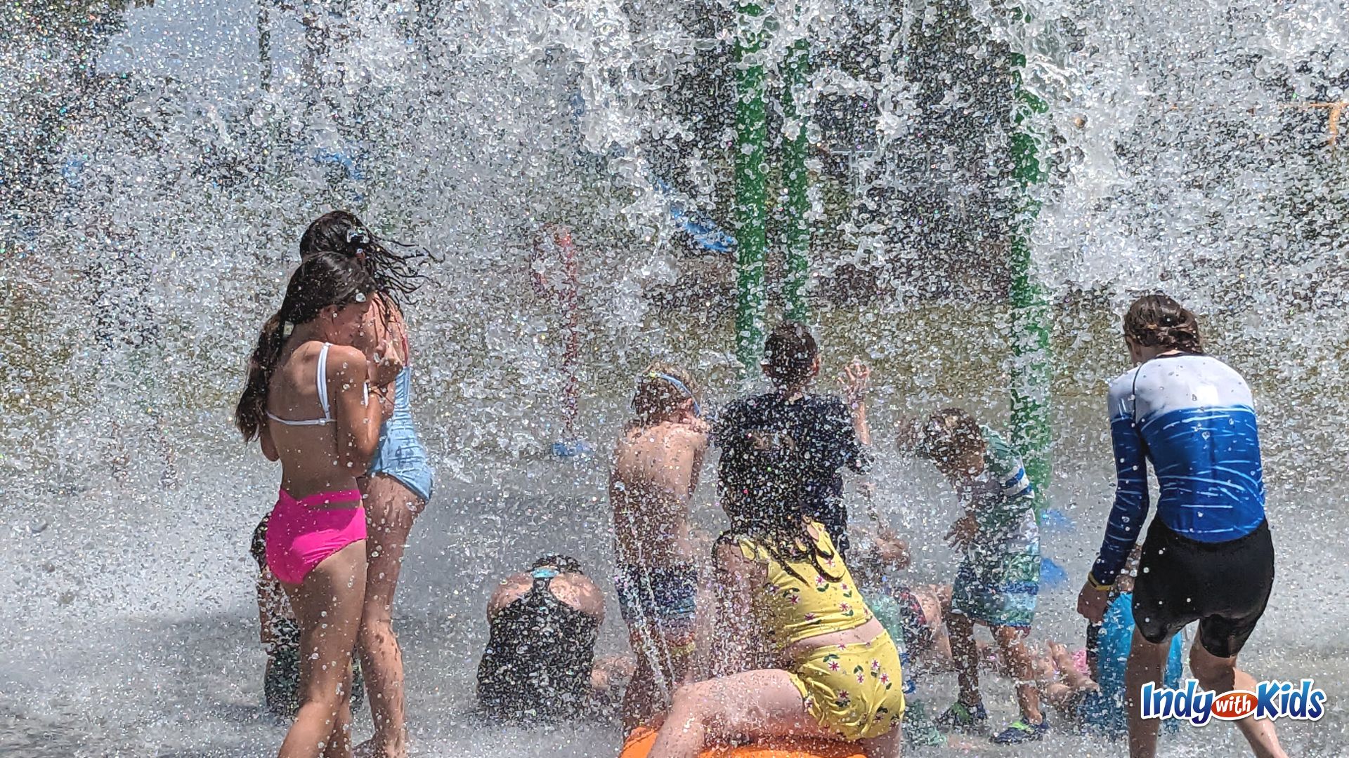 Kids love the splash from the giant dumping bucket at the Kephart Park splash pad.