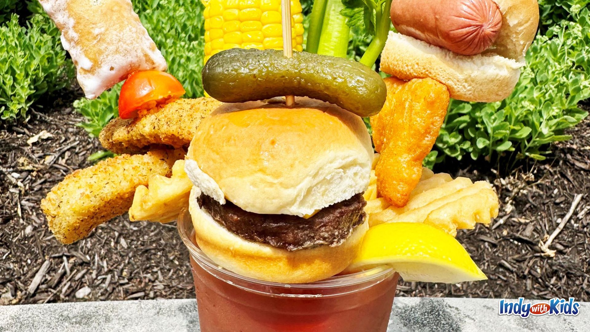 Indiana State Fair Food: A Bloody Mary loaded with miniature cookout foods, including a cheeseburger slider, dill pickle, waffle fry, mini hot dog, and more.