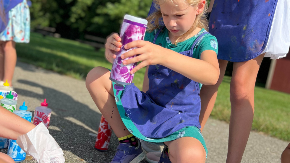 Sycamore Summer Programs 2026 - Girl tye-dying at summer camp