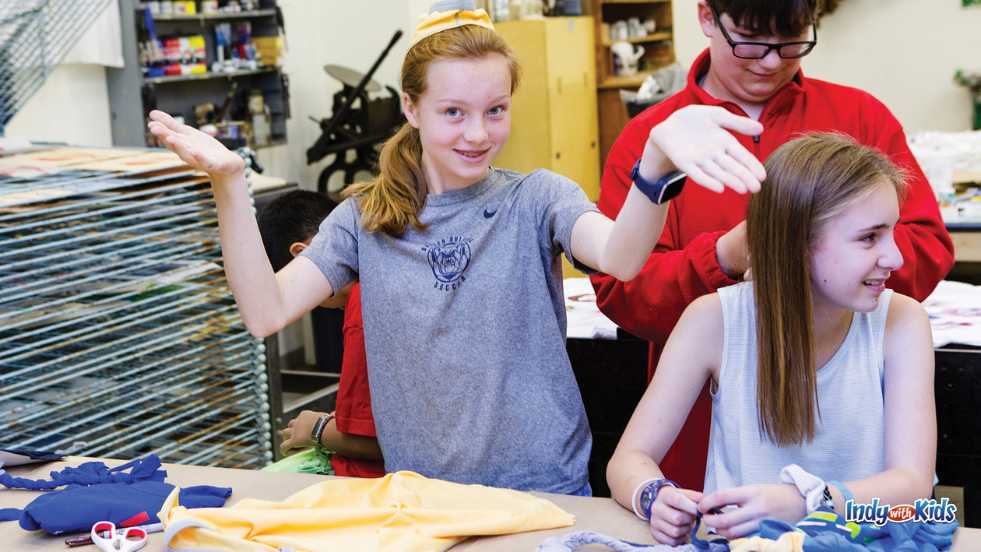 Indy Art Center teens working with fabrics in an art studio