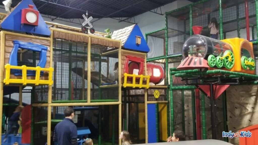 a multi level train-themed jungle gym for children