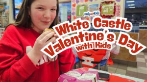 Girl at white castle restaurant on valentines day in red sweater with hamburger sliders