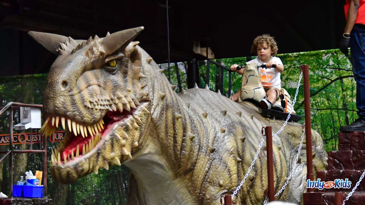 Jurassic Quest child riding a dinosaur