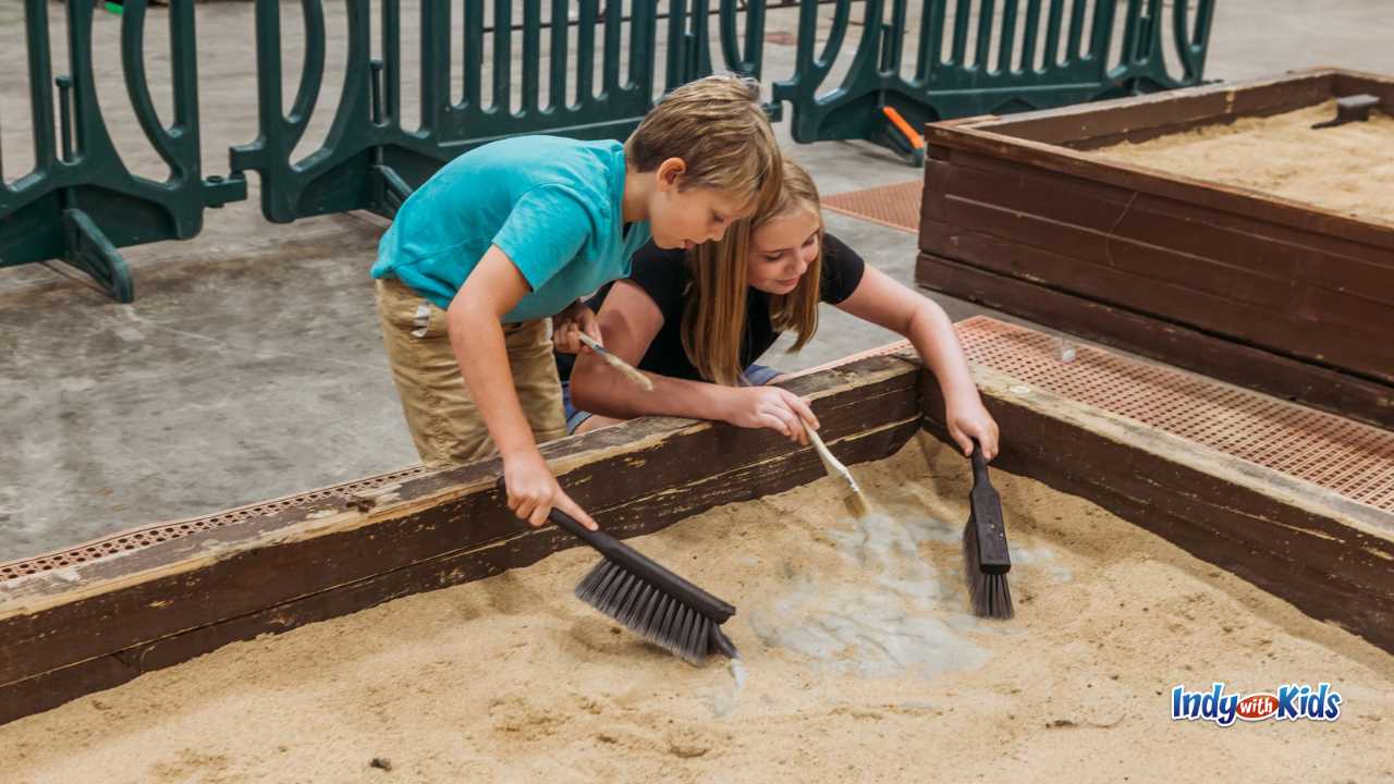 Jurassic Quest kids excavating sand