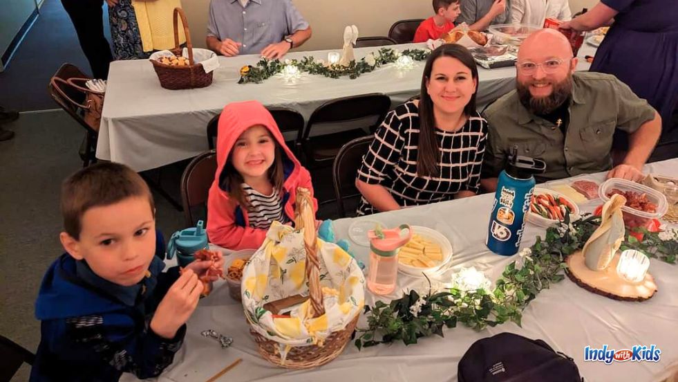 A family enjoys meats and cheeses from their Pascha Baskets at a feast in the Orthodox Church.