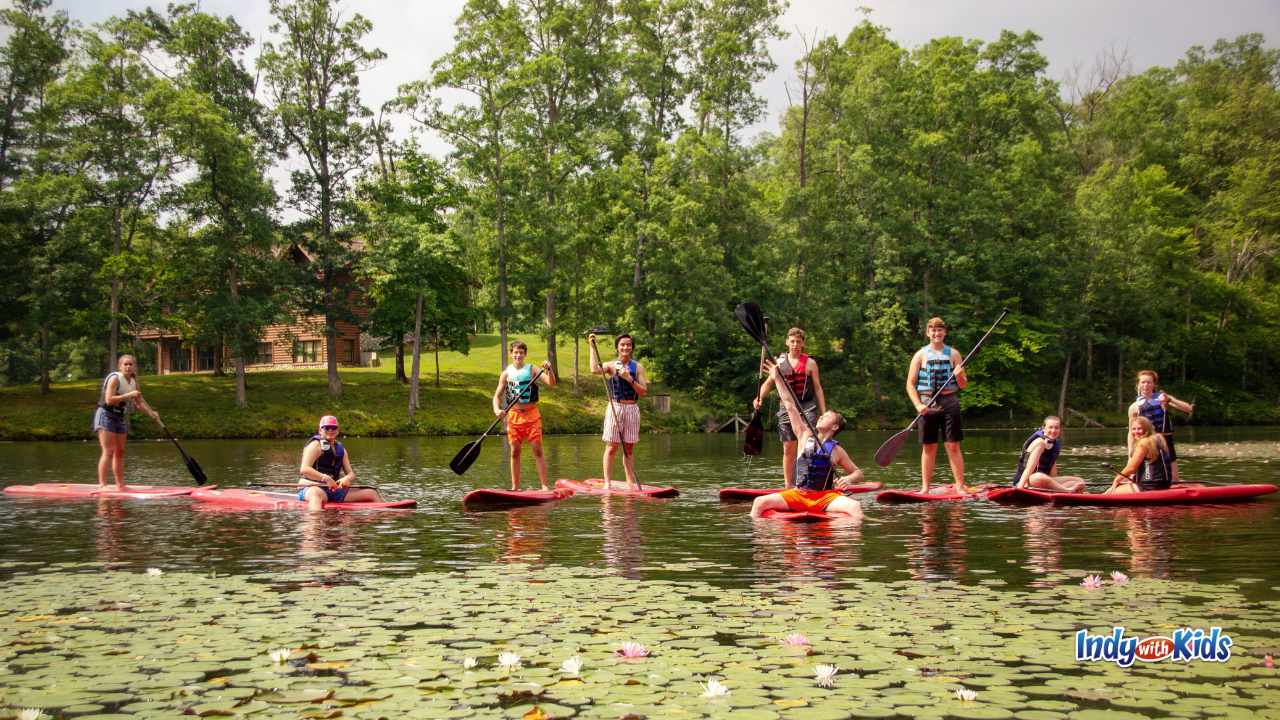SpringHill Christian Summer Camp paddle boarding on the lake