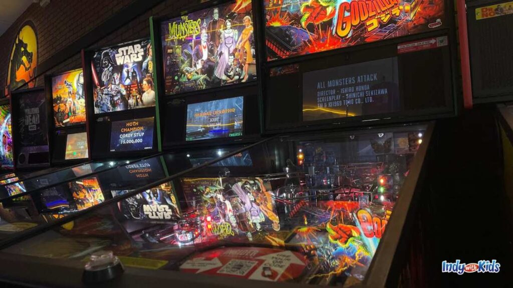 an up close shot at pinball machines at Boss Battle Games. there is Godzilla, the munsters, and star wars, among others