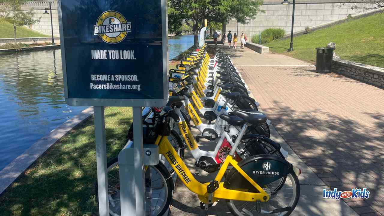 several bikes are lined up to be rented from the pacers bike share program along the canal in indy