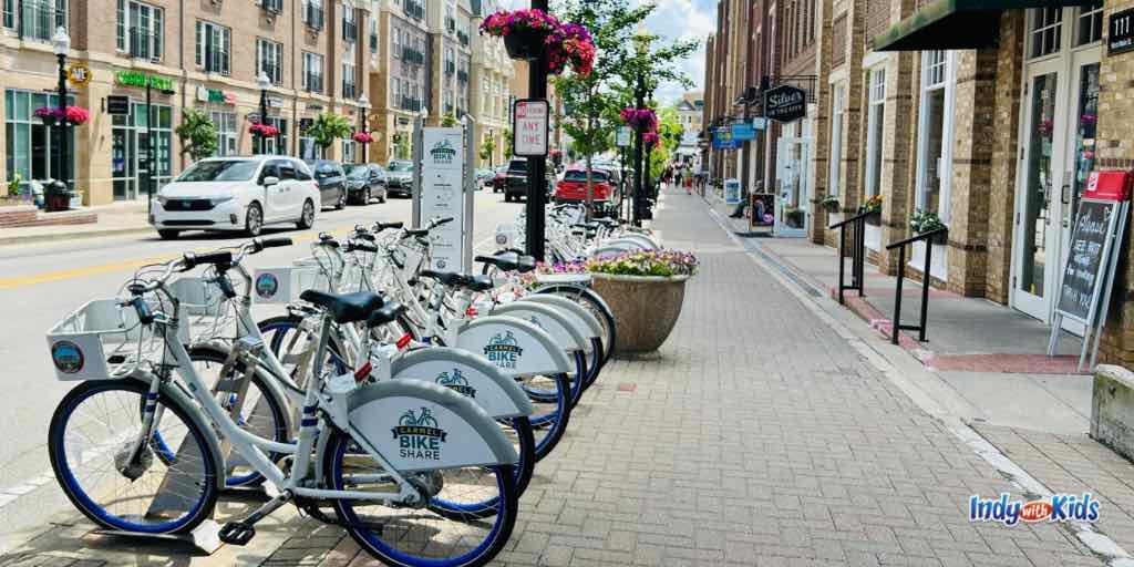 bikes for rent at the Carmel bike share are parked on main street in carmel