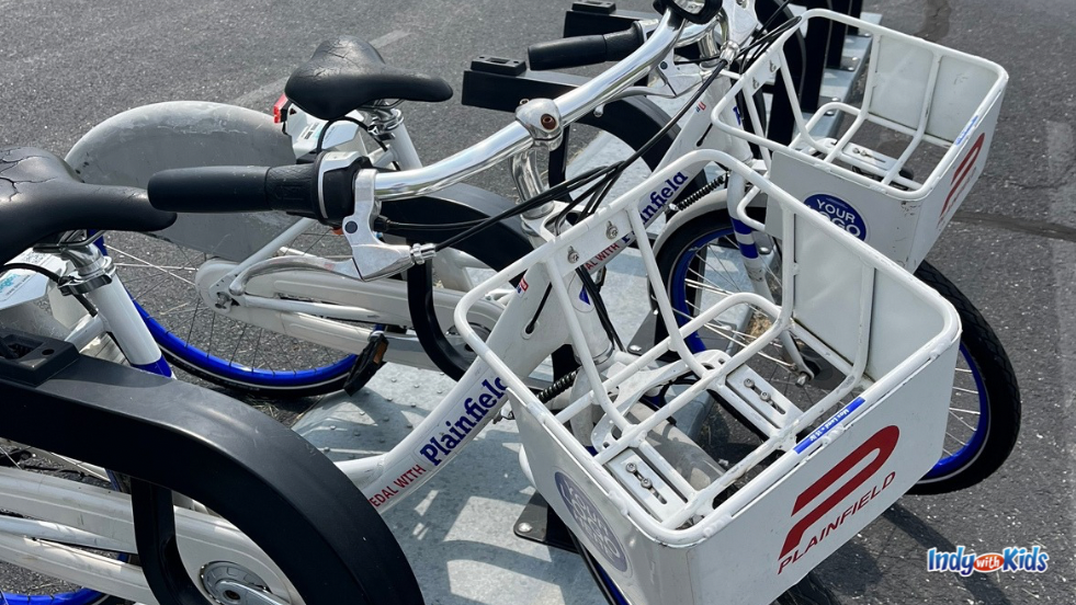 a close up of the Plainfield bike share bikes with metal baskets in front