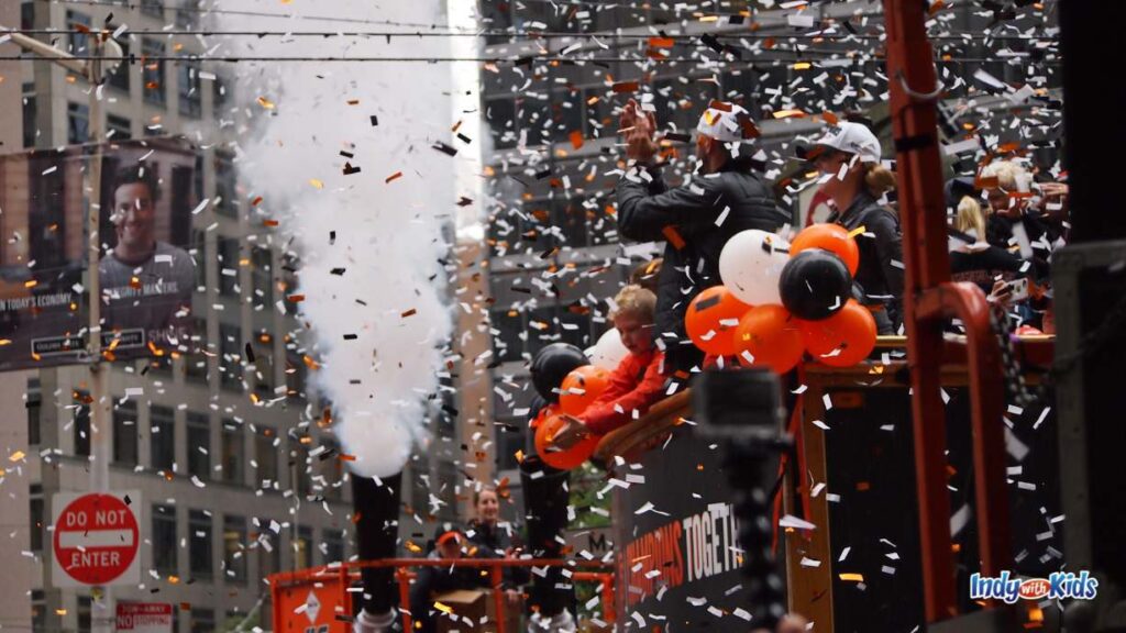 Indianapolis Christmas Parades 2024: confetti falls from the sky at a Christmas parade