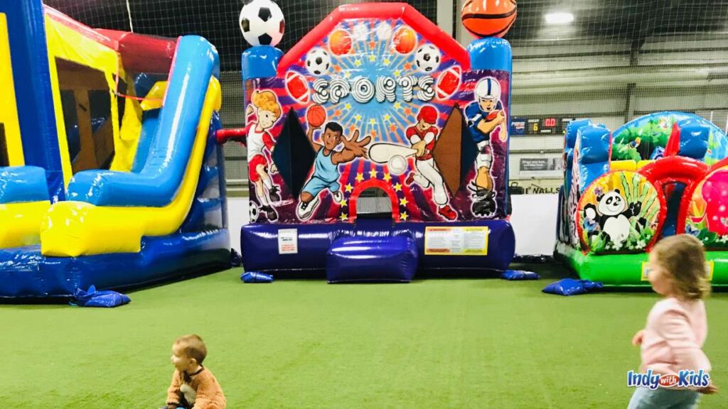 3 different inflatable bounce houses are pictured at Off the Wall Sports Carmel