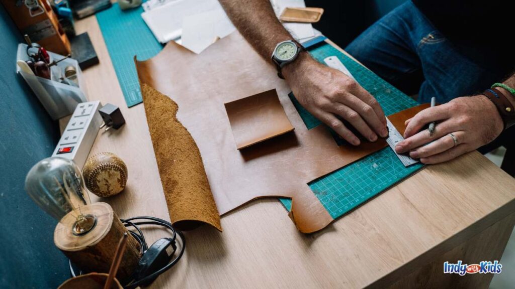 Date Night Ideas ZIONSVILLE EDITION: a craft maker measures leather to cut on a craft table