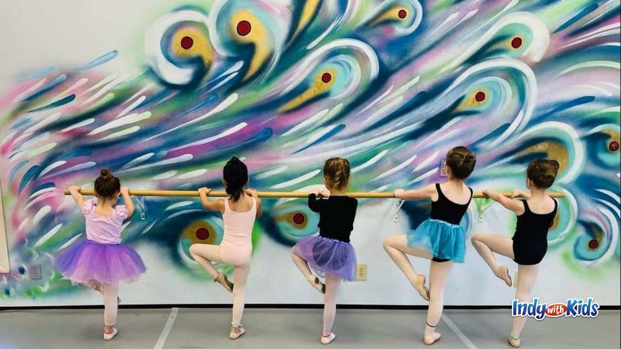 En Pointe five girls standing at the bar for ballet class