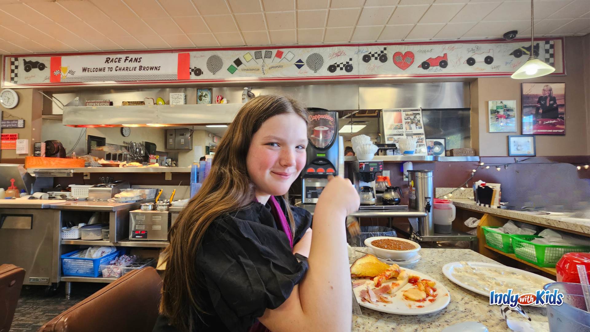 Kid eating breakfast at Charlie Brown’s Pancake and Steak House in Speedway, Indiana, a race-themed restaurant near the Indianapolis Motor Speedway