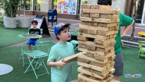 SPARK! on the circle two boys playing giant jenga