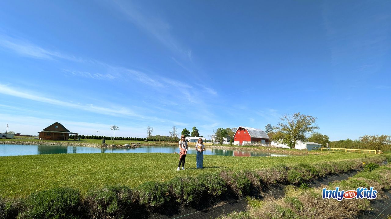 A beautiful sunny day with the lake and barn in the background at Woolly Yak Ranch and Winery in Arcadia, Indiana.