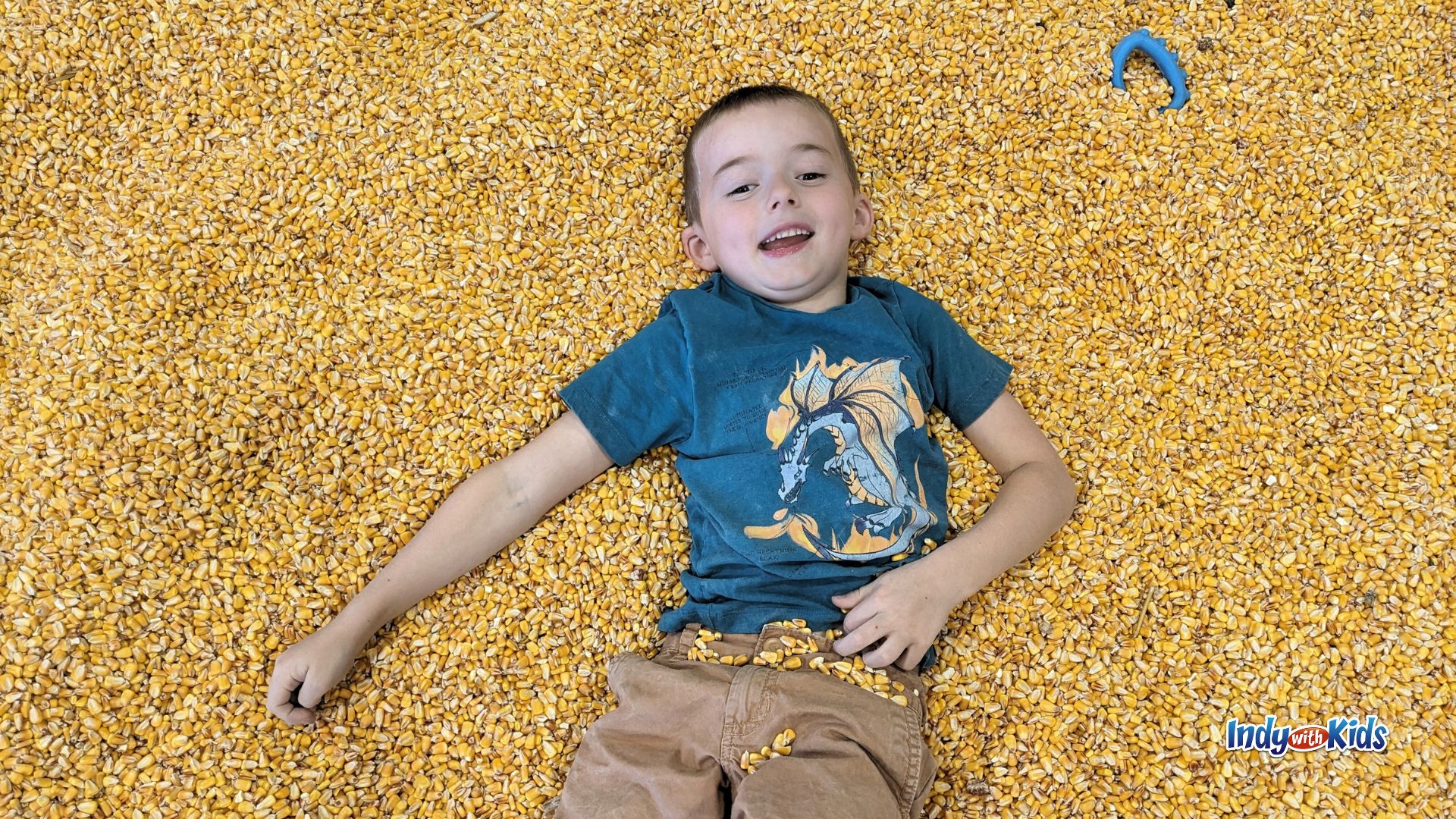 A boy plays in the corn crib play area at Tuttle Orchards in Greenfield.