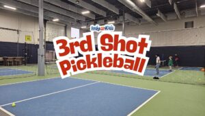 Text over image reads "3rd Shot Pickleball" - Kids playing pickleball on indoor courts at 3rd Shot Pickleball in Indianapolis