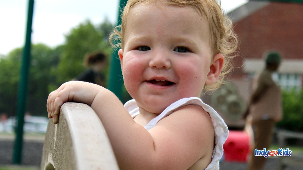 IU Indianapolis’ Center for Young Children - toddler playing outside on a playground