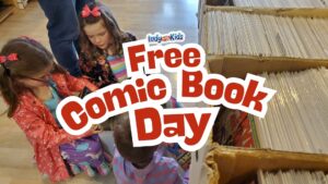 Kids choosing free comics from boxes during Free Comic Book Day in Indianapolis