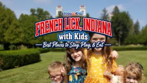 Children pose outdoors in French Lick, Indiana, with the West Baden Springs Hotel dome visible in the background.